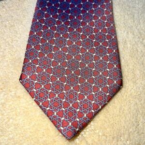 Hermes silk necktie. 7122 FA. Orange & grey geometric pattern. 3.5”
